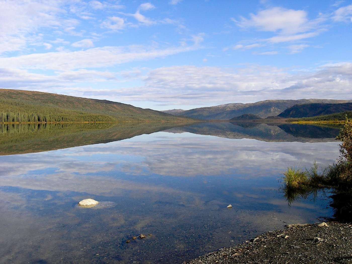 A mountain reflected exactly in a still lake