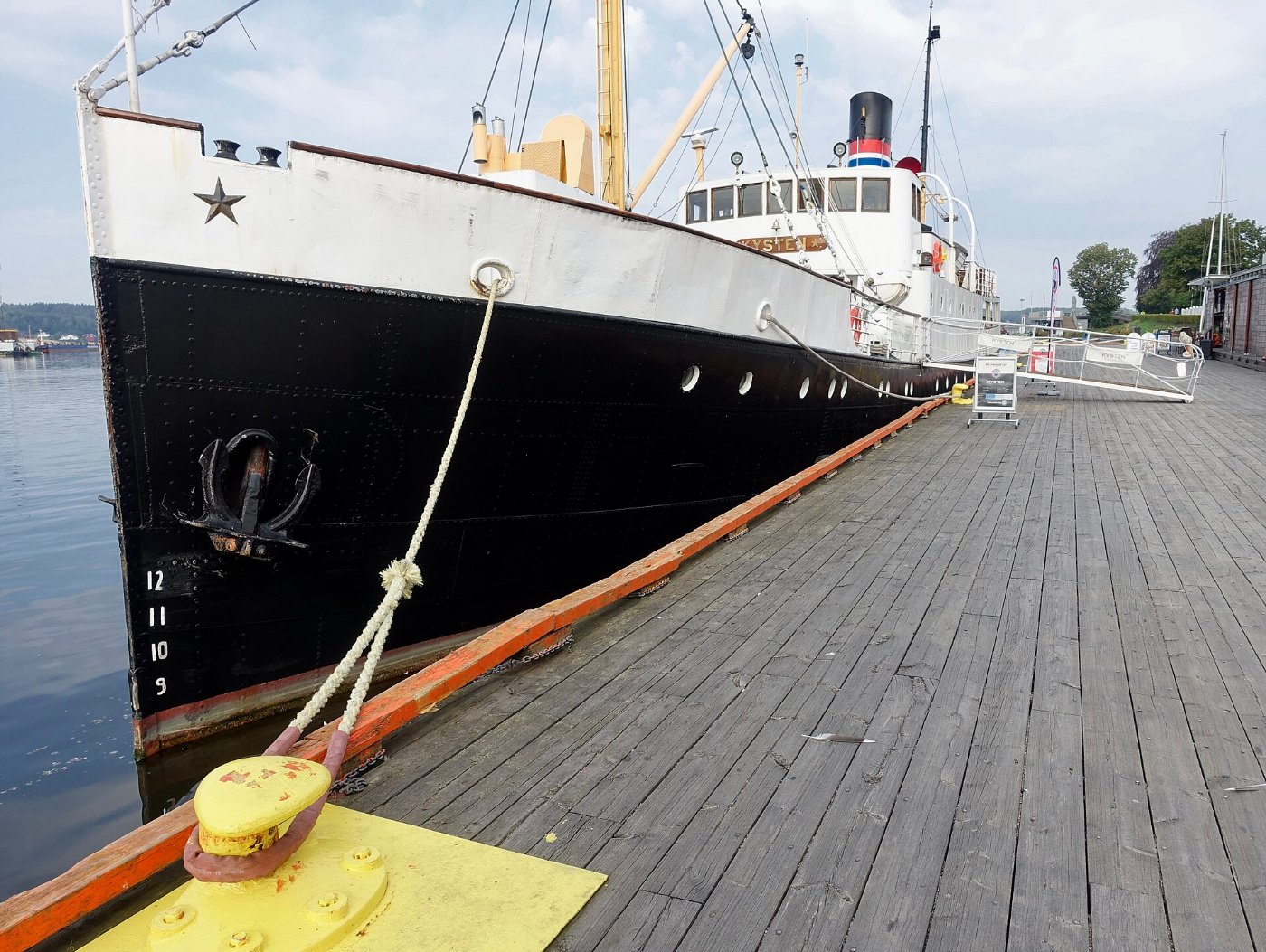A ship’s anchor holding fast, rope taut against the tide